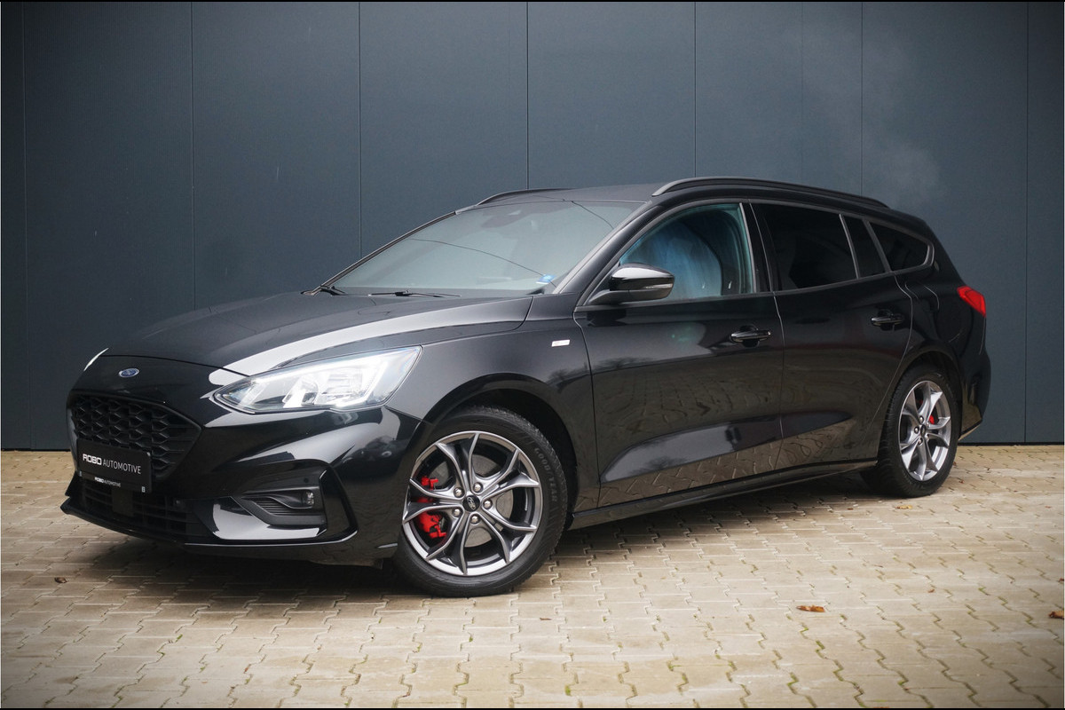 Ford FOCUS Wagon 1.0 EcoBoost ST-LINE | AUTOMAAT | CAMERA | LED | KEYLESS | APPLE CARPLAY | STOEL/STUUR VERWARMING | SIDE ASSIST | LED | PDC | CRUISE CONTROL | AUT. AIRCO | RODE ACCENTEN |
