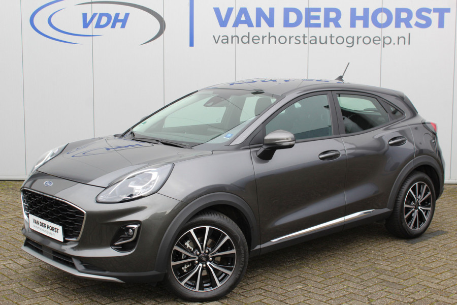 Ford Puma 1.0-125pk EcoBoost Hybrid Titanium. Garantie t/m 21-05-2027 ! Slechts 14.750km ! Volautm. airco, metallic lak, stoel-, stuur- en voorraamverwarming, navigatie, telefoonvoorbereiding, elektrische achterklep, cruise cntrl, keyless entry / keyless go etc.