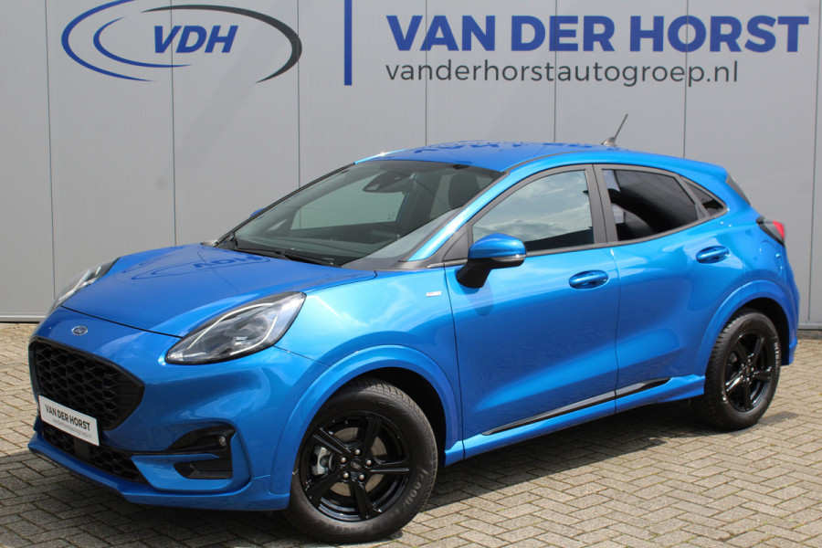 Ford Puma 1.0-125pk EcoBoost ST-Line. Sportieve hoogzitter, slechts 15.000km ! Airco, cruise cntrl, navigatie, telefoonvoorb., stoel-, stuur- en voorraamverwarming, LED verlichting, metallic lak, LM wielen, privacy glass etc.