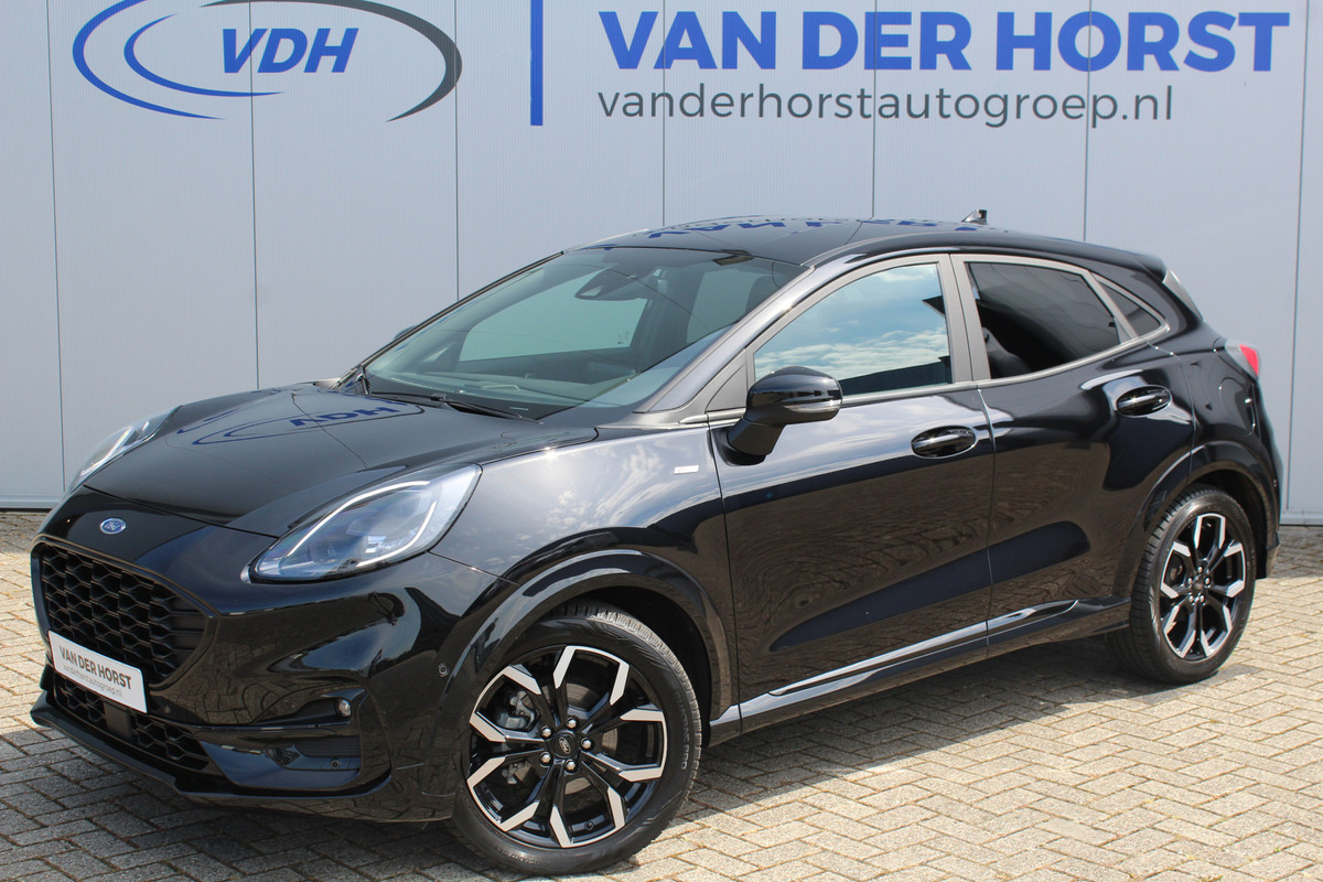 Ford Puma 1.0-125pk EcoBoost Hybrid ST-Line X. Mooie sportieve hoogzitter, slechts 18.500 km ! Volautm. airco, beide stoelen in hoogte verstelb., navigatie, telefoonvoorb., LM wielen, metallic lak, camera, parkeersensoren v+a, stoel-, stuur- en voorraamverwarming, DAB radio etc.