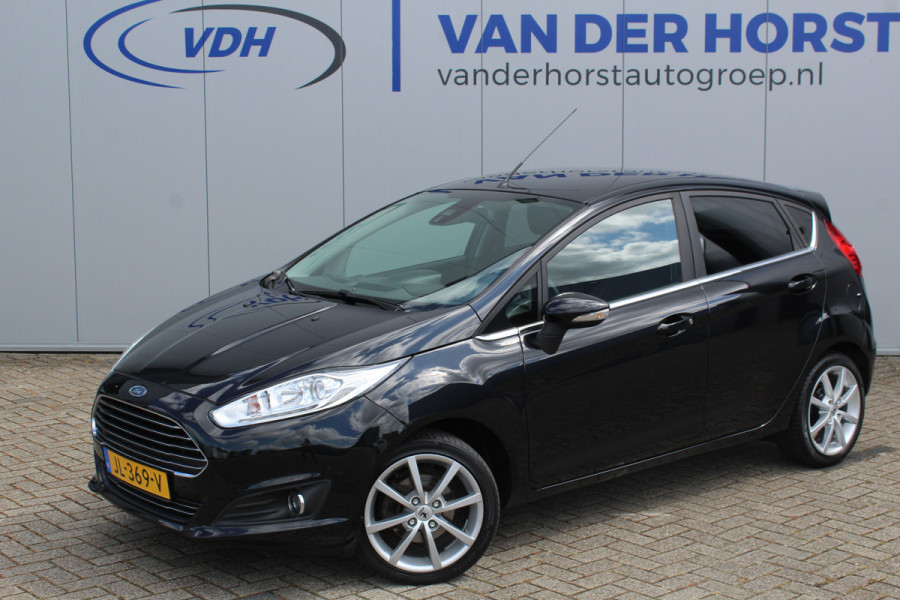 Ford Fiesta 1.0-100pk EcoBoost Titanium. Leuke sportieve en zuinige Ford Fiesta ! Volautm. airco, LM wielen, privacy glass, cruise control, navigatie, telefoonvoorbereiding, metallic lak, 5drs., trekhaak, verwarmd voorraam etc.