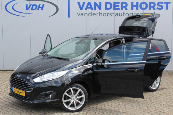 Ford Fiesta 1.0-100pk EcoBoost Titanium. Leuke sportieve en zuinige Ford Fiesta ! Volautm. airco, LM wielen, privacy glass, cruise control, navigatie, telefoonvoorbereiding, metallic lak, 5drs., trekhaak, verwarmd voorraam etc.