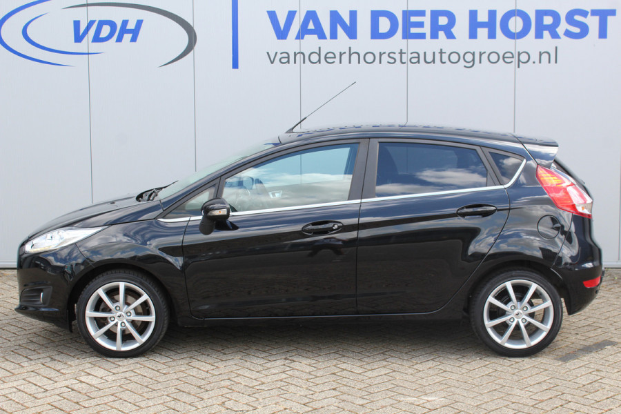 Ford Fiesta 1.0-100pk EcoBoost Titanium. Leuke sportieve en zuinige Ford Fiesta ! Volautm. airco, LM wielen, privacy glass, cruise control, navigatie, telefoonvoorbereiding, metallic lak, 5drs., trekhaak, verwarmd voorraam etc.