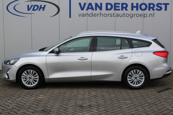 Ford FOCUS Wagon 1.0-125pk EcoBoost Mild-hybrid Titanium. Mooie, ruime, luxe en comfortabele Ford Focus wagon. Volautm. airco dual, camera, easy entry/easy go, stoel-, stuur- en voorraamverw., cruise control, Isofix, side- en lane assist, parkeersensoren v+a, LM wielen etc.