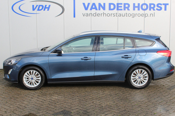 Ford FOCUS Wagon 1.0-125pk EcoBoost Mild-hybrid Titanium. Mooie, ruime, luxe en comfortabele Ford Focus wagon. Volautm. airco dual, camera, stoel-, stuur- en voorraamverw., easy entry/easy go, cruise control, Isofix, side- en lane assist, parkeersensoren v+a, LM wielen etc.