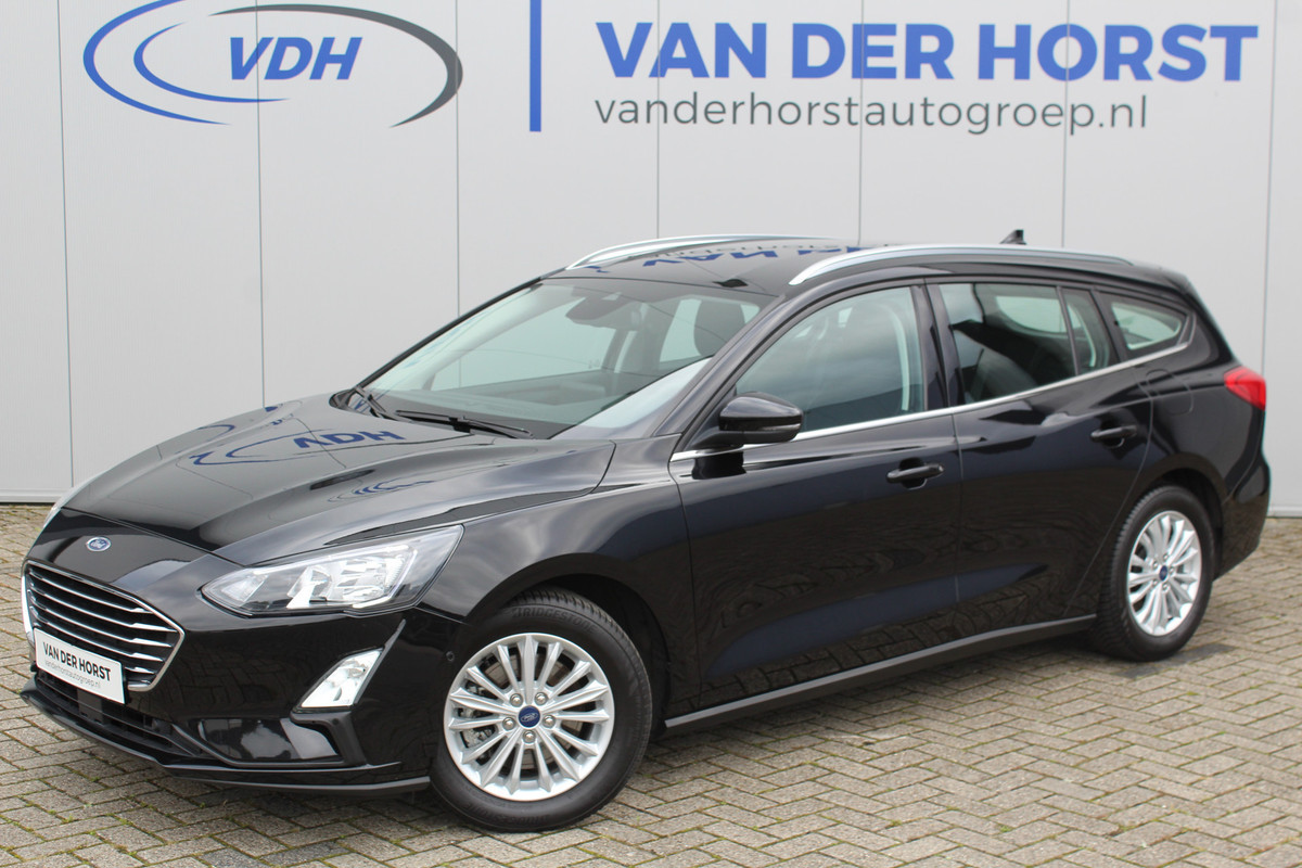 Ford FOCUS Wagon 1.0-125pk EcoBoost Mild-hybrid Titanium. Mooie, ruime, luxe en comfortabele Ford Focus wagon. Volautm. airco dual, camera, stoel-, stuur- en voorraamverw., easy entry/easy go, cruise control, Isofix, side- en lane assist, parkeersensoren v+a, LM wielen etc.