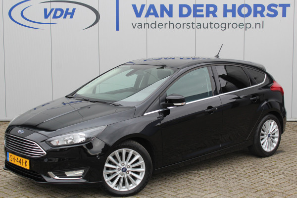 Ford Focus 1.0-125pk Titanium. Nette en goed onderhouden Ford Focus hatchback in de luxe Titanium uitvoering. Volautm. airco dual, cruise control, navigatie, telefoonvoorb., keyless entry-keyless go, LM wielen, verwarmd voorraam, parkeersensoren v~a etc.