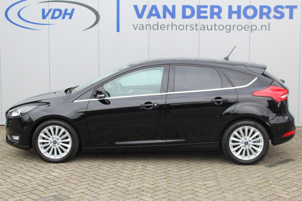 Ford Focus 1.0-125pk Titanium. Nette en goed onderhouden Ford Focus hatchback in de luxe Titanium uitvoering. Volautm. airco dual, cruise control, navigatie, telefoonvoorb., keyless entry-keyless go, LM wielen, verwarmd voorraam, parkeersensoren v~a etc.