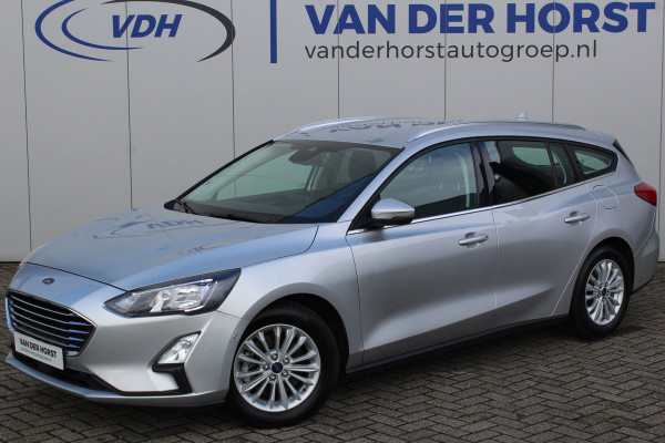 Ford FOCUS Wagon 1.0-125pk EcoBoost Mild-hybrid Titanium. Mooie, ruime, luxe en comfortabele Ford Focus wagon. Volautm. airco dual, camera, easy entry/easy go, stoel-, stuur- en voorraamverw., cruise control, Isofix, side- en lane assist, parkeersensoren v+a, LM wielen etc.