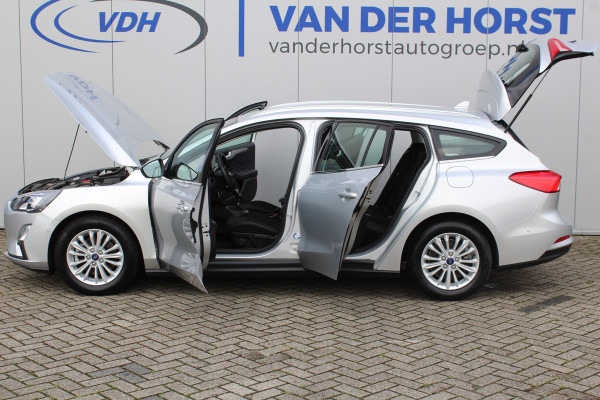 Ford FOCUS Wagon 1.0-125pk EcoBoost Mild-hybrid Titanium. Mooie, ruime, luxe en comfortabele Ford Focus wagon. Volautm. airco dual, camera, easy entry/easy go, stoel-, stuur- en voorraamverw., cruise control, Isofix, side- en lane assist, parkeersensoren v+a, LM wielen etc.