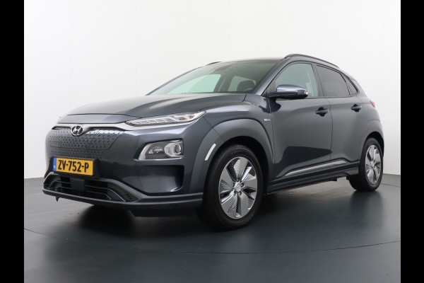 Hyundai Kona EV 64kWh 204pk Apple Carplay Android Auto Leder Navi Camera Head-Up Displ. Led Keyless PDC Elektr.Stoelen+Verwarmd+Ventilatie-koeling ! Adaptive Cruise/Stop&Go DAB Orig.NLse Auto Sterke EV, Enorm Efficient en grote accu! 444km WLTP