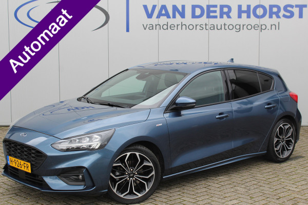 Ford Focus 1.0-125pk EcoBoost ST-Line Business AUTOMAAT ! Gun u het comfort en gemak van deze zeer nette en luxe Ford Focus automaat ! Volautm. airco, LED verl., trekhaak, LM wielen, stoel-, stuur- en voorraamverw., adapt. cruise cntrl, lane assist, camera, B&O soundsyst. etc.