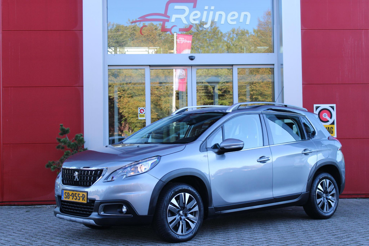 Peugeot 2008 1.2 110PK ALLURE | NAVIGATIE 10" TOUCHSCREEN | TREKHAAK | CLIMATE CONTROL | CRUISE CONTROL | LICHTMETALEN VELGEN | PARKEER SENSOREN | ALL SEASON BANDEN | REGEN/LICHT SENSOR |