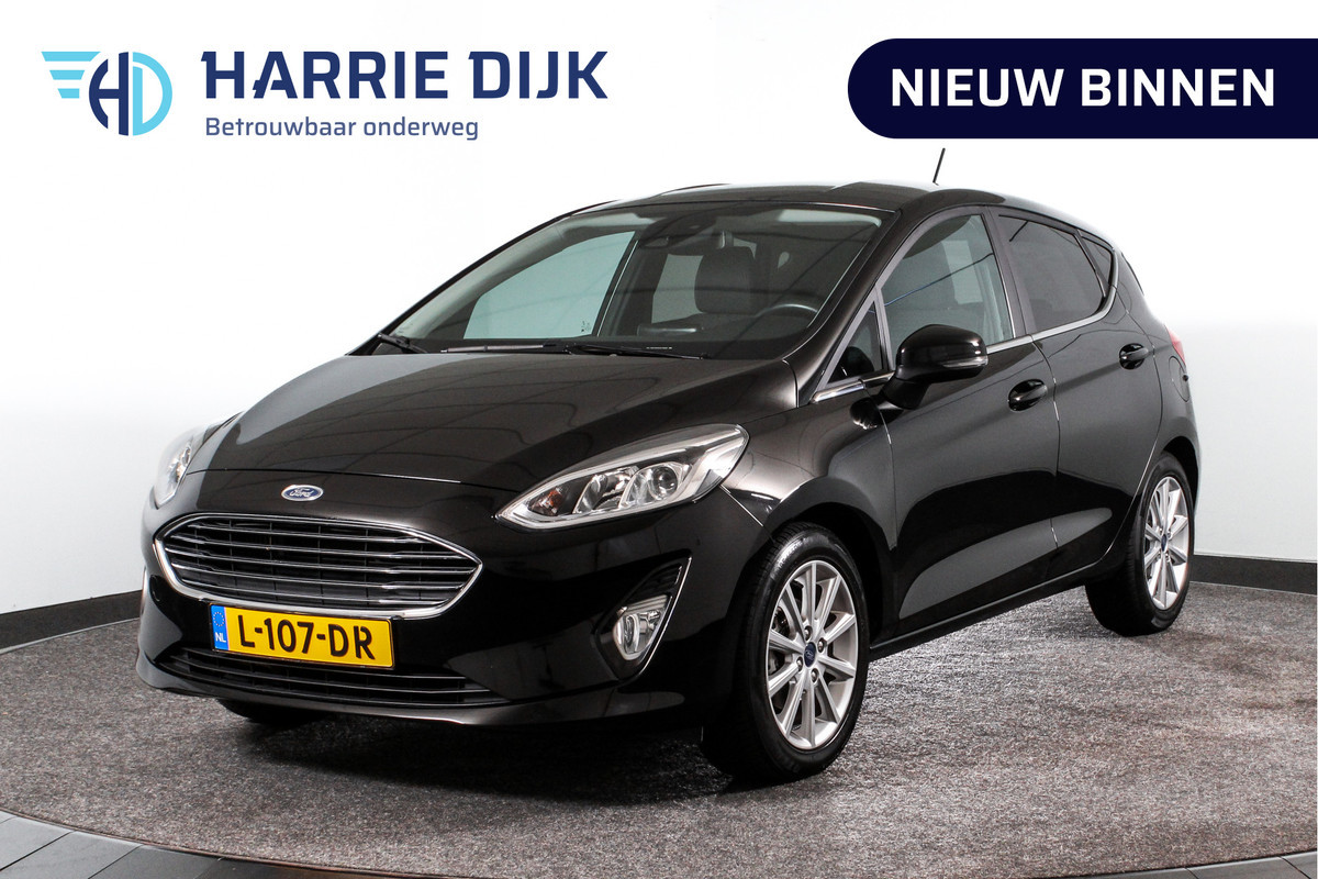 Ford Fiesta 1.0 EcoBoost Titanium | Cruise | Stoel + Stuurverwarming | PDC | App.Connect | DAB | Auto.Airco | Trekhaak | LM 16" |