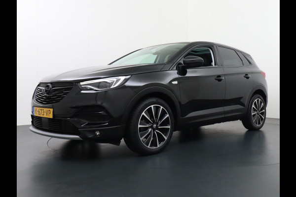 Opel Grandland X 1.6T 180PK Automaat Apple Carplay Android Auto Panoramadak Navi Ecc 360° Camera DAB Bluetooth Draadloze tel.lader Denon® Sound Dodehoek detector Lane Assist Lmv 19" Regen-Licht Sensor Pdc Adaptief licht Led Business Elegance 1e Eigenaar