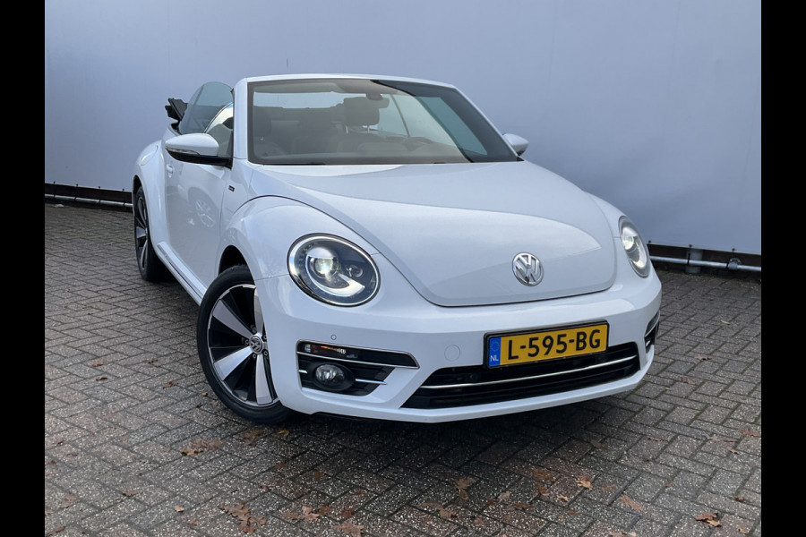 Volkswagen Beetle Cabriolet 1.2 TSI Autom Stoelverw Xenon Navi Camera Design BlueMotion Automaat