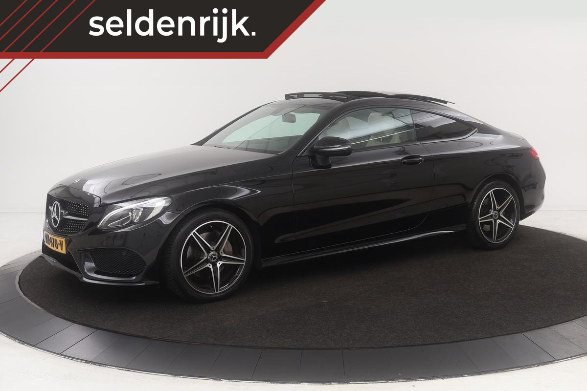 Mercedes-Benz C-Klasse 180 AMG Night | Panoramadak | Leder | Camera | Stoelverwarming | Full LED | Park Assist | Navigatie | Bluetooth