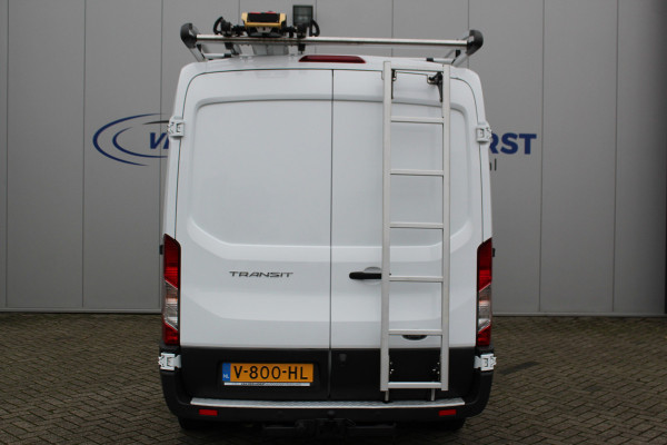 Ford Transit 290 2.0-105pk TDCI L2H2 Ambiente. Dames en heren ondernemers, u kunt direct los: compleet ingerichte Ford Transit ! Camera, parkeersensoren v+a, airco, ladder op achterdeur, opstaptrede met trekhaak, imperiaal met ladder, omvormer naar 220V voor opladen gereedschap etc etc.