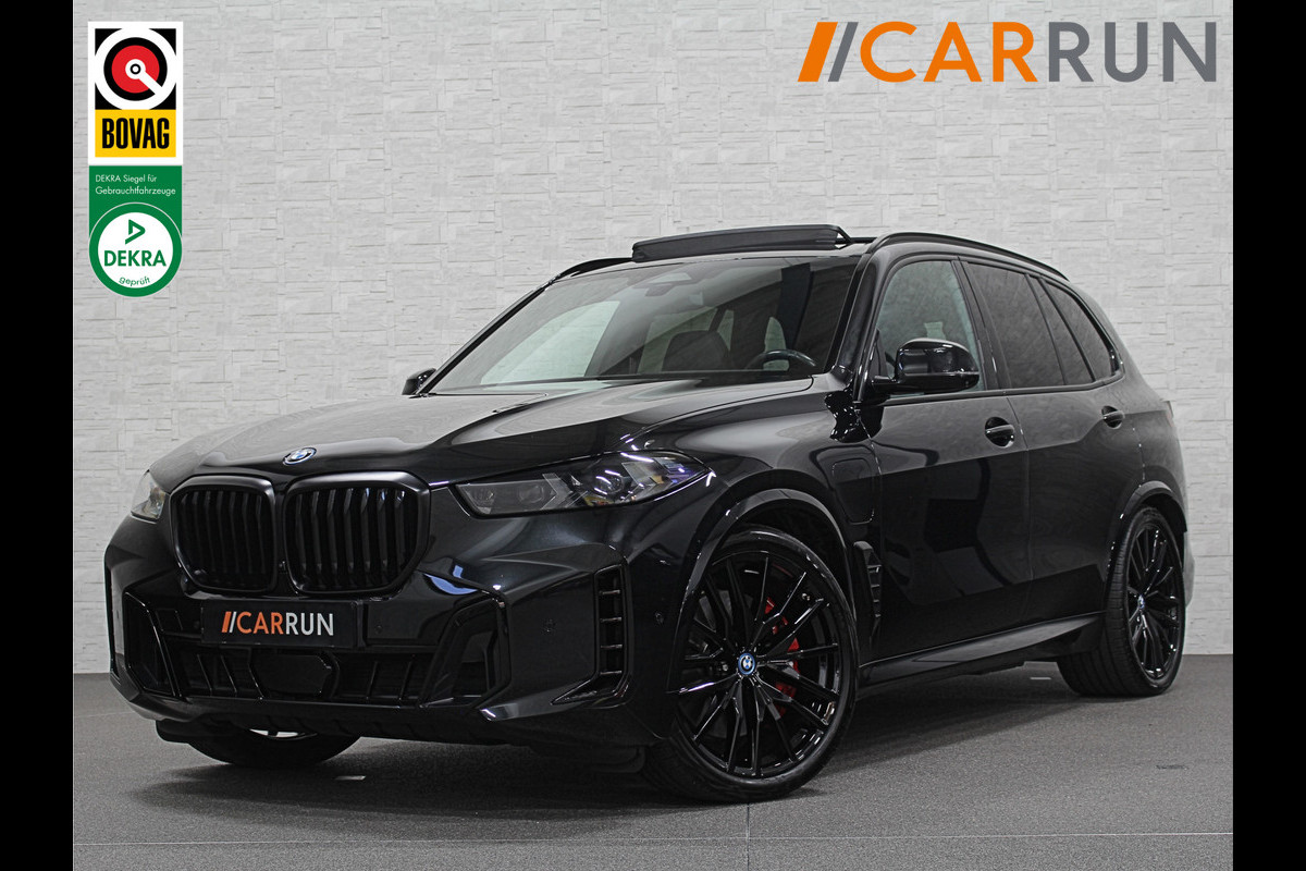 BMW X5 xDrive50e M-Sport Pro | B&W High-End | Sky-Lounge Pano | 360 View | ACC | Massage | Soft-Close | Head-Up | 4-Zone Clima | Stoelventilatie | 22'' | Stoelverwarming V+A | Laser-LED | Memory | Keyless-Entry | Trekhaak | Comfortstoelen | Beker Koeling+Verwarming | Stuurverwarming | Zonwering | Carplay | Draadloos Laden |