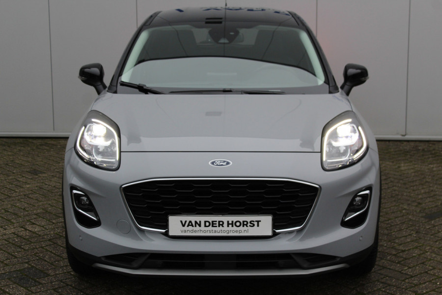 Ford Puma 1.0-125pk EcoBoost Mild-Hybrid Titanium X. Garantie t/m 22-04-2028 ! Slechts 5.800km ! Adaptive cruise cntrl, climate control, stoel-, stuur- en voorraamverw., navigatie, telefoonvoorb., camera, elektr. achterklep, B&O soundsyst., lane- en side assist, LED verlichting etc.