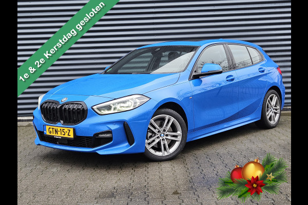 BMW 1-serie 118i M Sport Dealer O.H Misanoblauw | Panodak | Keyless |  Trekhaak Afn | Camera | Apple Carplay | Sfeerverlichting | Sportstoelen Verwarmd | Navi Pro |