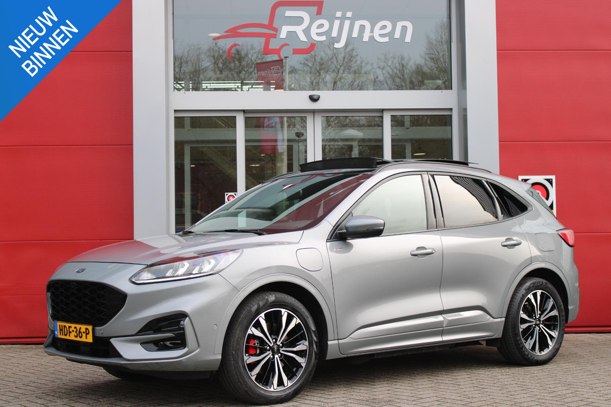 Ford Kuga 2.5 225PK PHEV ST-LINE | PANORAMISCH SCHUIF/KANTEL DAK | ELEKTRISCH BEDIENBARE ACHTERKLEP | FULL LED KOPLAMPEN | 360° CAMERA | KEYLESS ENTRY/START | CLIMATE CONTROL | ADAPTIVE CRUISE CONTROL | DAB+ RADIO | DRAADLOZE TELEFOONLADER | NAVIGATIE | APPLE CARPLAY/ANDROID AUTO | DODEHOEK DETECTIE |