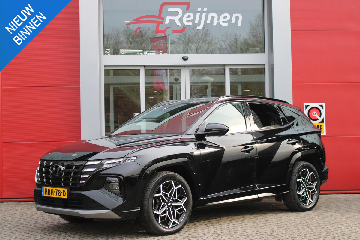 Hyundai Tucson 1.6 T-GDI 266PK PHEV N LINE 4WD | NAVIGATIE | APPLE CARPLAY/ANDROID AUTO | ADAPTIVE CRUISE CONTROL | DODEHOEK DETECTIE | STOEL/STUUR VERWARMING | CLIMATE CONTROL | FULL LED KOPLAMPEN | ACHTERUITRIJ CAMERA | ELEKTRISCH BEDIENBARE ACHTERKLEP | STUUR VERWARMING | KEYLESS ENTRY/START | 19" LICHTMETALEN VELGEN | DODEHOEK DETECTIE | PANORAMISCH SCHUIF/KANTEL DAK |