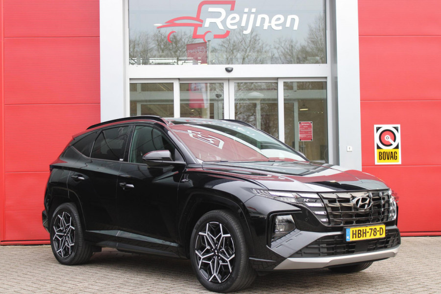 Hyundai Tucson 1.6 T-GDI 266PK PHEV N LINE 4WD | NAVIGATIE | APPLE CARPLAY/ANDROID AUTO | ADAPTIVE CRUISE CONTROL | DODEHOEK DETECTIE | STOEL/STUUR VERWARMING | CLIMATE CONTROL | FULL LED KOPLAMPEN | ACHTERUITRIJ CAMERA | ELEKTRISCH BEDIENBARE ACHTERKLEP | STUUR VERWARMING | KEYLESS ENTRY/START | 19" LICHTMETALEN VELGEN | DODEHOEK DETECTIE | PANORAMISCH SCHUIF/KANTEL DAK |