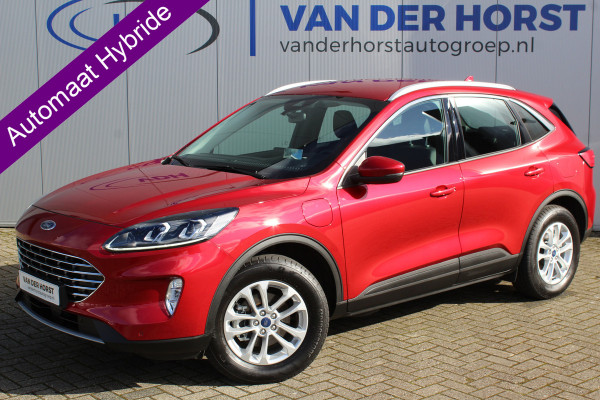 Ford Kuga 2.5-225pk PHEV Titanium X Plug-In-Hybrid. Fabrieksgarantie t/m 04-01-2028 ! Slechts 4.900km ! Elektr. trekhaak / achterklep, stoel-, stuur- en voorraamverw., volautm. airco, navigatie, telefoonvoorb., LM wielen, metallic lak, AGR comfortst., head-up-display, LED verl. etc.