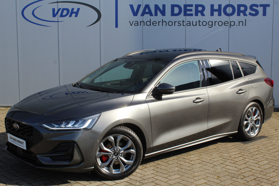 Ford FOCUS Wagon 1.0-125pk EcoBoost ST-Line X. Geweldig mooie, luxe en sportieve Focus wagon ! Slechts 12.000km ! Autm. airco, stoel-, stuur- en voorraamverw., ergonomische stoelen, adaptieve cruise cntrl, side- en lane assist, elektr. panodak, B&O soundsyst., etc.