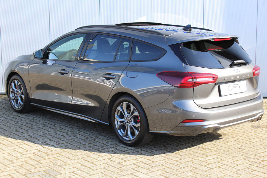 Ford FOCUS Wagon 1.0-125pk EcoBoost ST-Line X. Geweldig mooie, luxe en sportieve Focus wagon ! Slechts 12.000km ! Autm. airco, stoel-, stuur- en voorraamverw., ergonomische stoelen, adaptieve cruise cntrl, side- en lane assist, elektr. panodak, B&O soundsyst., etc.