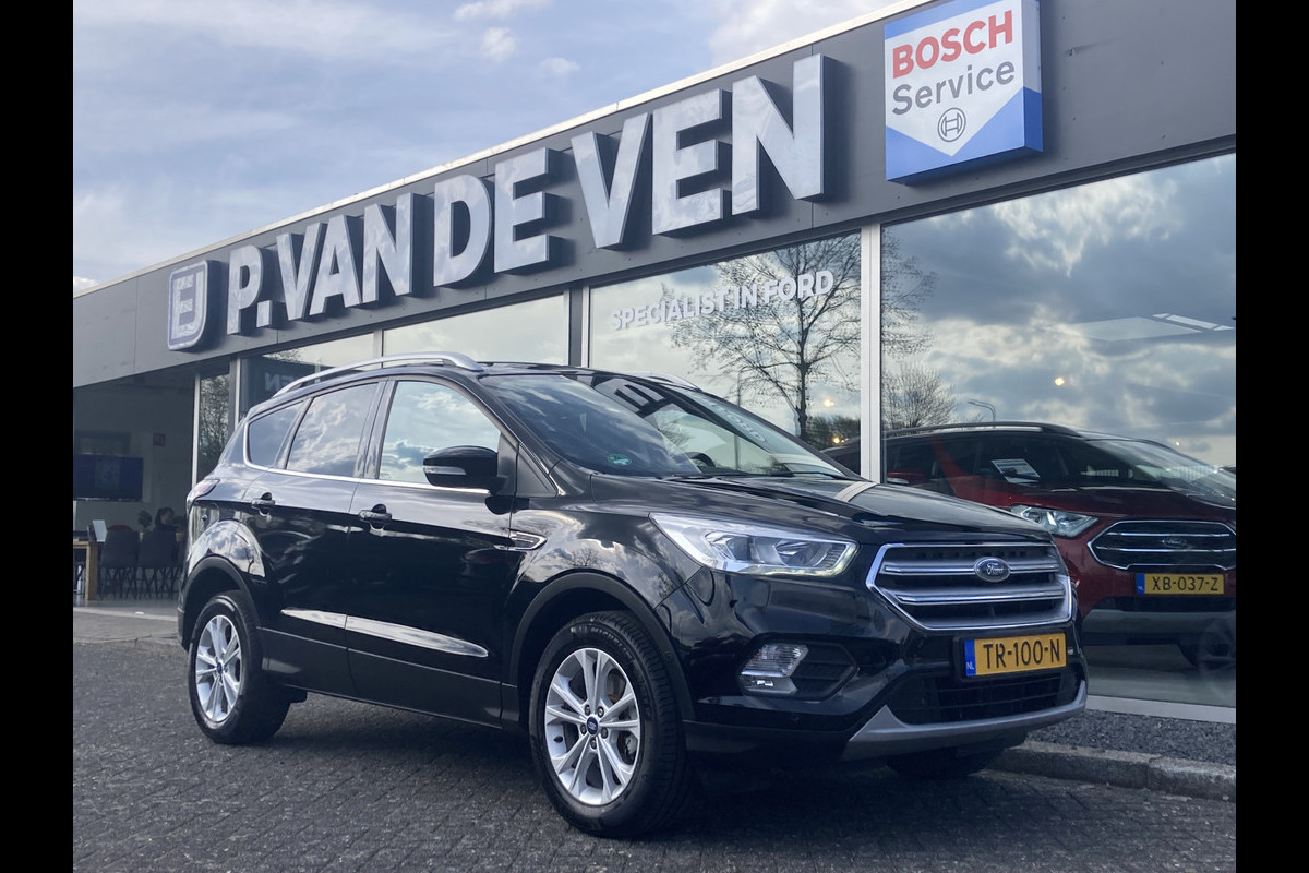 Ford Kuga 1.5 EcoBoost Titanium 150pk/110kW 6-bak | Trekhaak | Camera | Elek. klep | Dodehoek | Rijstrook | Winter Pack | etc. etc. Ford Kuga 1.5 EcoBoost Titanium 150pk/110kW 6-bak | Trekhaak | Camera | Elek. klep | Dodehoek | Rijstrook | Winter Pack | etc. etc.
