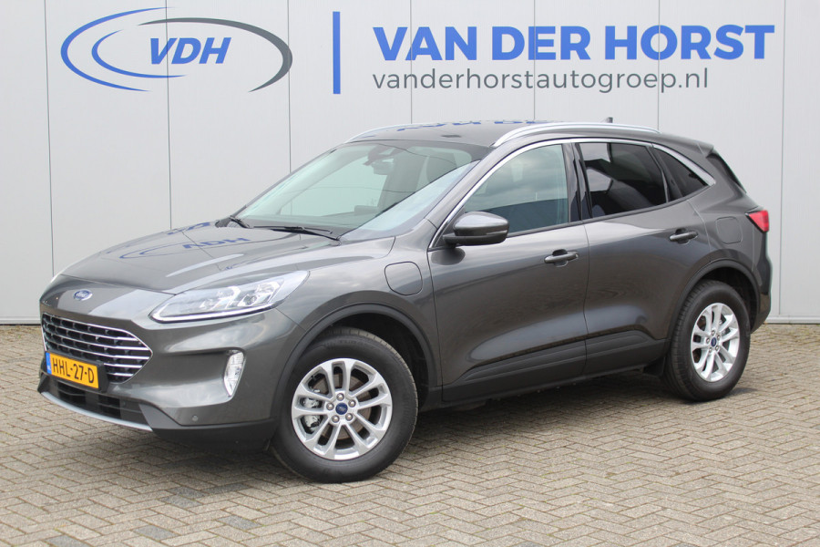 Ford Kuga 2.5-225pk PHEV Titanium X Plug-In Hybrid. Fabr. garantie t/m 07-04-2028 ! Slechts 10.000km ! Autm. airco dual, stoel-, stuur- en voorraamverw., LED verl., B&O soundsyst., metallic lak, cruise control, camera, LM wielen, elektr. achterklep en best. stoel etc.