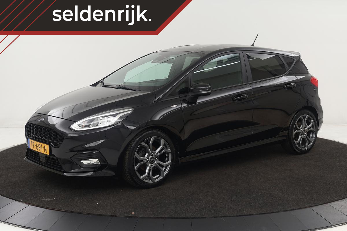 Ford Fiesta 1.0 EcoBoost ST-Line | Stoel & stuurverwarming | Carplay | PDC | Navigatie | Climate control | Cruise control Ford Fiesta 1.0 EcoBoost ST-Line | Stoel & stuurverwarming | Carplay | PDC | Navigatie | Climate control | Cruise control