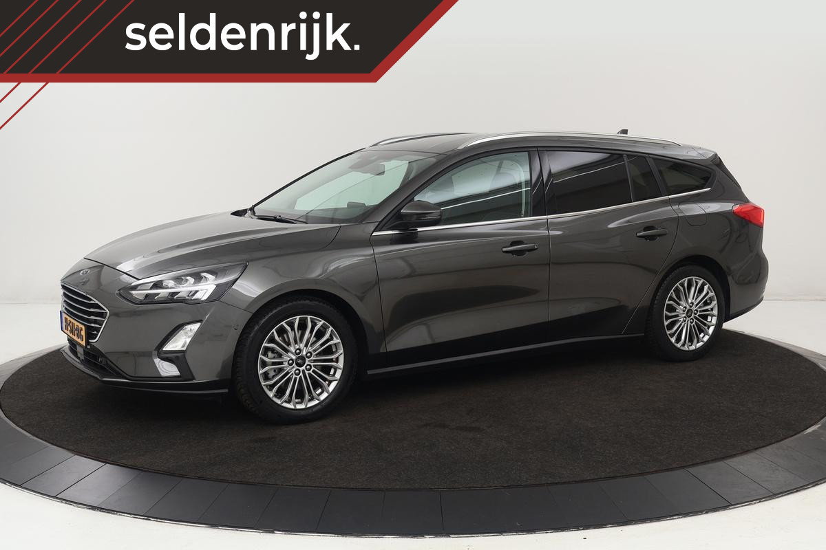 Ford Focus 1.0 EcoBoost Titanium | Trekhaak | Camera | Full LED | Navigatie | Keyless | Park Assist | Climate control | Getint glas Ford Focus 1.0 EcoBoost Titanium | Trekhaak | Camera | Full LED | Navigatie | Keyless | Park Assist | Climate control | Getint glas