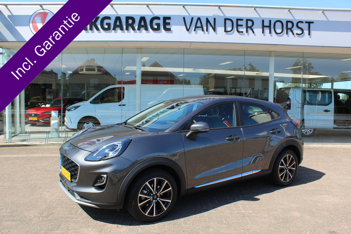 Ford Puma 1.0-125pk EcoBoost Hybrid Titanium. Garantie t/m 21-05-2027 ! Slechts 14.750km ! Volautm. airco, metallic lak, stoel-, stuur- en voorraamverwarming, navigatie, telefoonvoorbereiding, elektrische achterklep, cruise cntrl, keyless entry / keyless go etc. Ford Puma 1.0-125pk EcoBoost Hybrid Titanium. Garantie t/m 21-05-2027 ! Slechts 14.750km ! Volautm. airco, metallic lak, stoel-, stuur- en voorraamverwarming, navigatie, telefoonvoorbereiding, elektrische achterklep, cruise cntrl, keyless entry / keyless go etc.