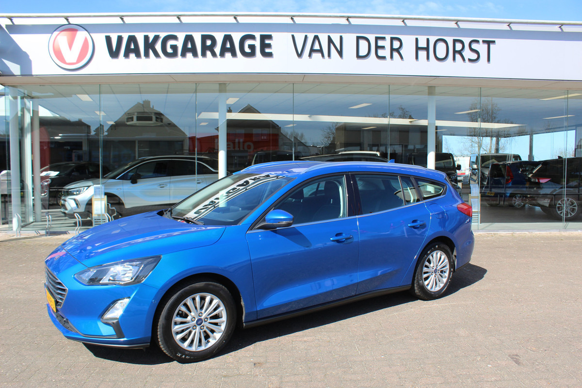 Ford FOCUS Wagon 1.0-125pk EcoBoost Mild-Hybrid Titanium. Mooie, ruime, luxe en comfortabele Ford Focus wagon. Volautm. airco dual, camera, stoel-, stuur- en voorraamverw., easy entry/easy go, cruise control, Isofix, side- en lane assist, parkeersensoren v+a, LM wielen etc. Ford FOCUS Wagon 1.0-125pk EcoBoost Mild-Hybrid Titanium. Mooie, ruime, luxe en comfortabele Ford Focus wagon. Volautm. airco dual, camera, stoel-, stuur- en voorraamverw., easy entry/easy go, cruise control, Isofix, side- en lane assist, parkeersensoren v+a, LM wielen etc.