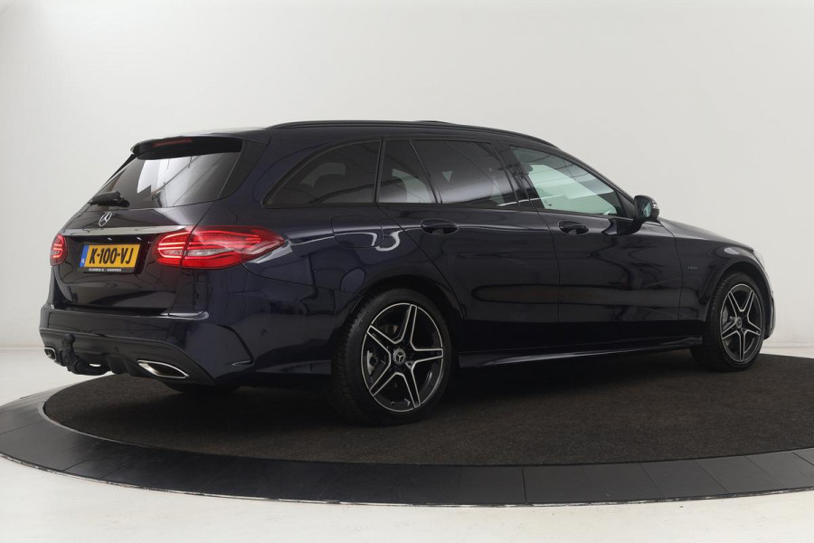 Mercedes-Benz C-Klasse 300e AMG | Panoramadak | Stoelverwarming | 360 camera | Trekhaak | Carplay | Dodehoek detectie | Matrix LED | Navigatie | Half leder