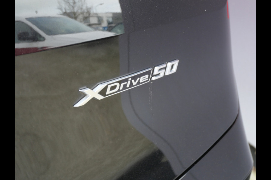 BMW iX xDrive50 BUSINESS ED. PLUS | 112 kWh | PANORAMA | CRYSTAL | TREKHAAK | LUCHTVERING | 1e EIG!!