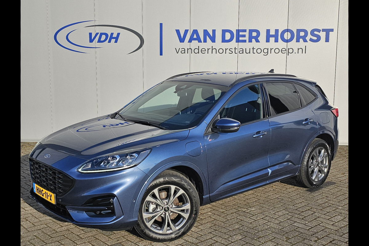 Ford Kuga 2.5-225pk PHEV ST-Line X Plug-in Hybrid. Garantie t/m 04-02-2028 ! Slechts 5.500km ! Volautm. airco dual, elektr. achterklep, LM wielen, stuur-, stoel- en voorraamverwarming, camera v+a, side- en lane assist, adaptieve cruise cntrl, metallic lak, etc. Ford Kuga 2.5-225pk PHEV ST-Line X Plug-in Hybrid. Garantie t/m 04-02-2028 ! Slechts 5.500km ! Volautm. airco dual, elektr. achterklep, LM wielen, stuur-, stoel- en voorraamverwarming, camera v+a, side- en lane assist, adaptieve cruise cntrl, metallic lak, etc.