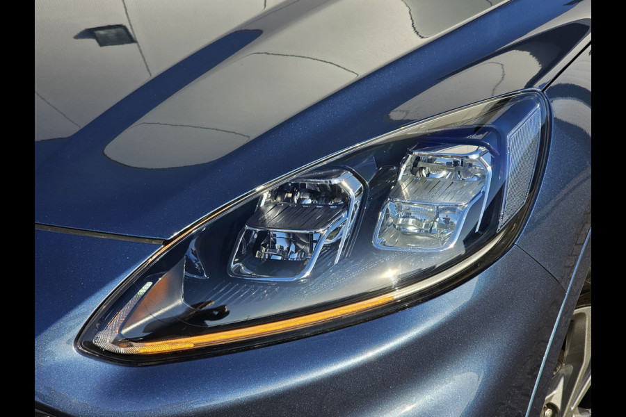 Ford Kuga 2.5-225pk PHEV ST-Line X Plug-in Hybrid. Garantie t/m 04-02-2028 ! Slechts 5.500km ! Volautm. airco dual, elektr. achterklep, LM wielen, stuur-, stoel- en voorraamverwarming, camera v+a,  side- en lane assist, adaptieve cruise cntrl, metallic lak, etc.