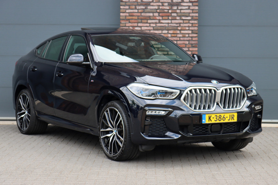 BMW X6 xDrive40i High Executive M Sport Aut8 | ACC | Carbon | Panoramadak | Memory | Surround Camera | Iconic Glow | Laser | HUD | Merino Leder | Trekhaak | Verwarmd Stuurwiel |