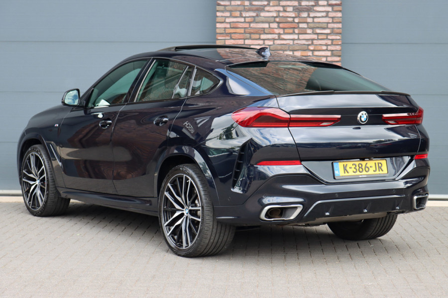 BMW X6 xDrive40i High Executive M Sport Aut8 | ACC | Carbon | Panoramadak | Memory | Surround Camera | Iconic Glow | Laser | HUD | Merino Leder | Trekhaak | Verwarmd Stuurwiel |