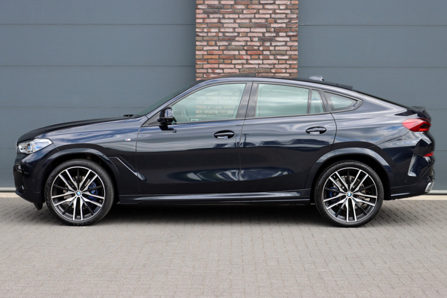 BMW X6 xDrive40i High Executive M Sport Aut8 | ACC | Carbon | Panoramadak | Memory | Surround Camera | Iconic Glow | Laser | HUD | Merino Leder | Trekhaak | Verwarmd Stuurwiel |