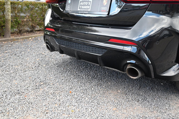 BMW 1-serie M135i xDrive High Executive 306 PK Dealer o.h. Adaptive Head Up Camera Keyless 18''