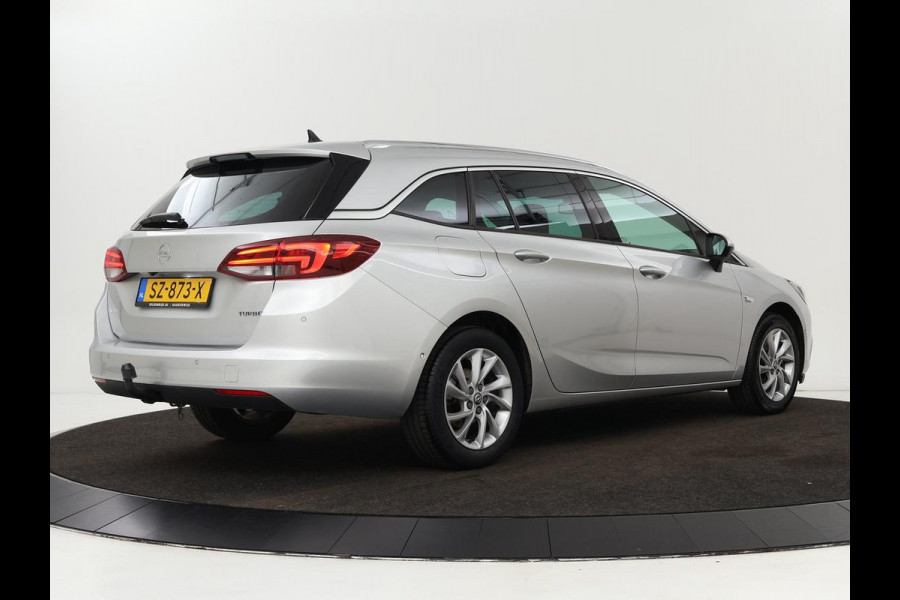 Opel Astra Sports Tourer 1.4 Innovation | Trekhaak | Apple Carplay | Achteruitrijcamera | Cruise Control | Navigatie | Dodehoek Detectie | DAB | LMV