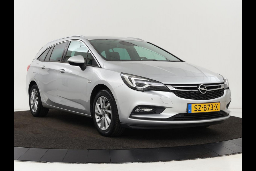 Opel Astra Sports Tourer 1.4 Innovation | Trekhaak | Apple Carplay | Achteruitrijcamera | Cruise Control | Navigatie | Dodehoek Detectie | DAB | LMV