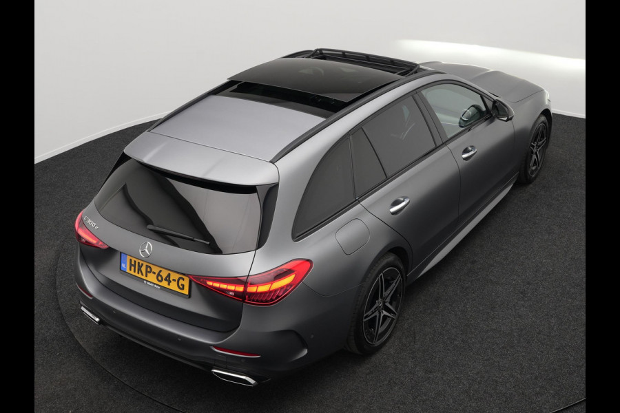Mercedes-Benz C-Klasse Estate 300 e AMG Line Plug in Hybrid Selenite Magno PHEV | Panodak | Trekhaak af Fabriek | Adaptive Cruise | Elektrische Stoelen met  Memory | Carplay | Sfeerverlichting | MBUX | Navigatie | 360 Camera | DAB | Virtual |