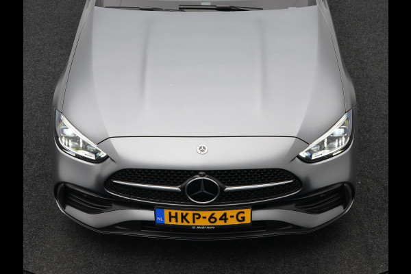 Mercedes-Benz C-Klasse Estate 300 e AMG Line Plug in Hybrid Selenite Magno PHEV | Panodak | Trekhaak af Fabriek | Adaptive Cruise | Elektrische Stoelen met  Memory | Carplay | Sfeerverlichting | MBUX | Navigatie | 360 Camera | DAB | Virtual |