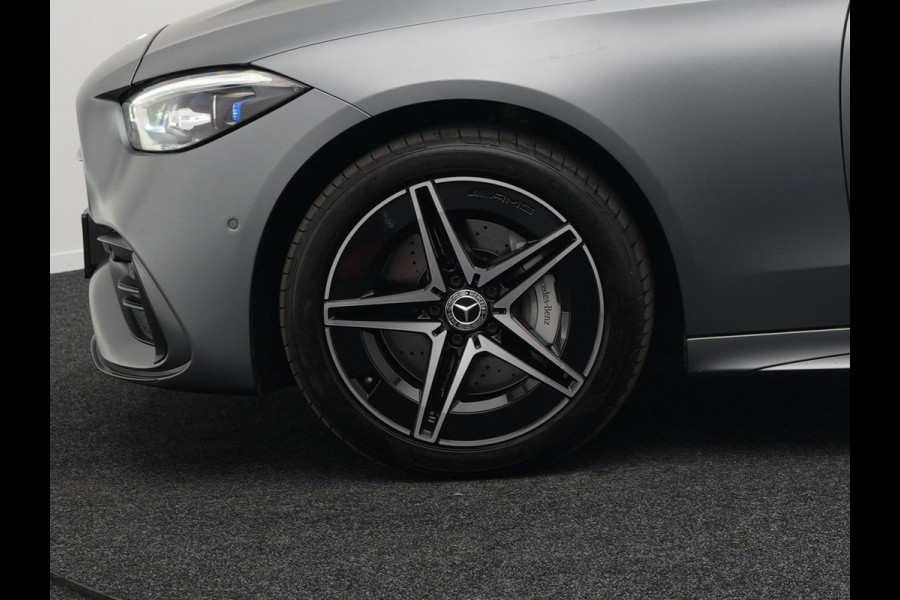 Mercedes-Benz C-Klasse Estate 300 e AMG Line Plug in Hybrid Selenite Magno PHEV | Panodak | Trekhaak af Fabriek | Adaptive Cruise | Elektrische Stoelen met  Memory | Carplay | Sfeerverlichting | MBUX | Navigatie | 360 Camera | DAB | Virtual |